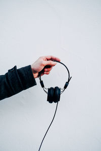 Woman holding headphones