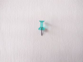 Close-up of lamp on table against white background