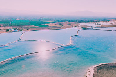 Aerial view of landscape against sky during winter