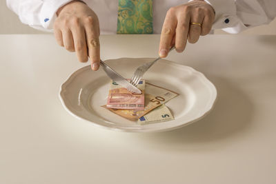 Close-up of hand holding cup