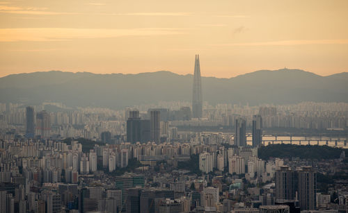 Cityscape against sky during sunset