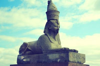 Low angle view of statue against sky