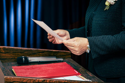 Midsection of man working at table