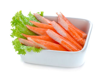 Close-up of burger against white background