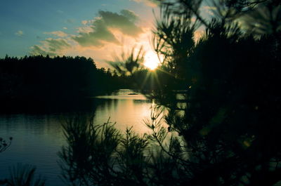 Scenic view of lake against sky during sunset