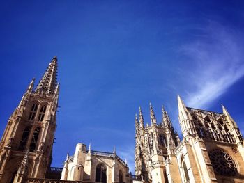 Low angle view of church against blue sky