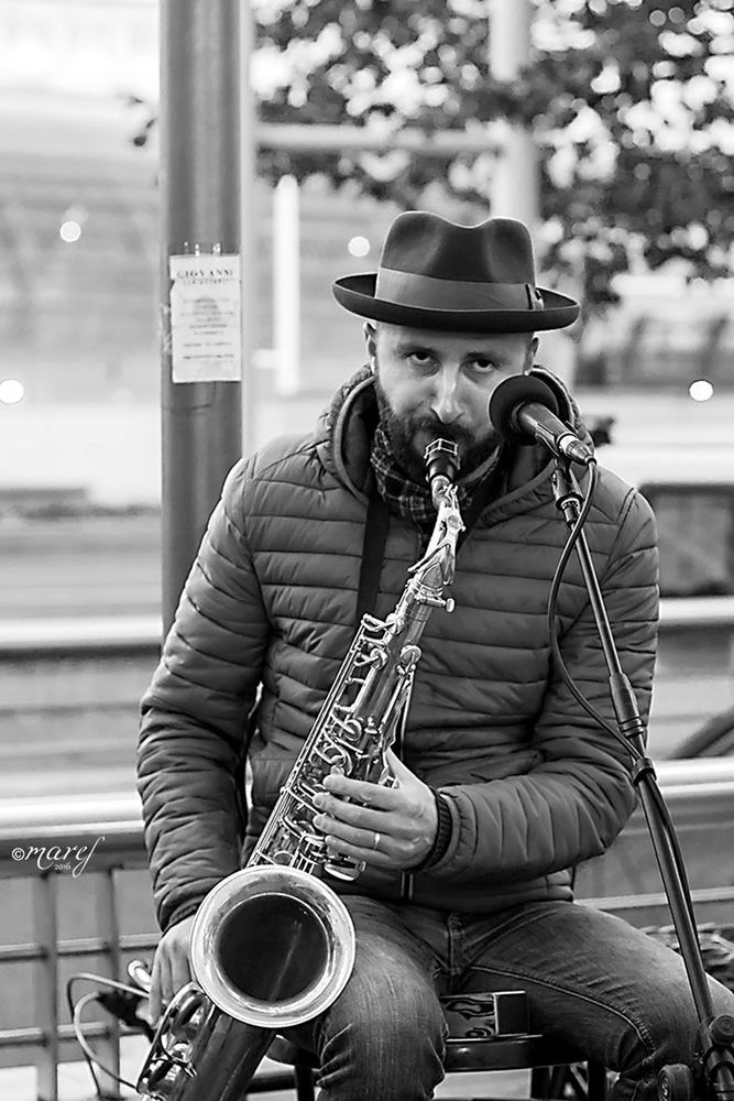 music, musician, musical instrument, playing, hat, only men, saxophone, arts culture and entertainment, men, jazz music, one man only, performance, adults only, adult, plucking an instrument, singing, young adult, saxophonist, people, one person, guitar, music festival, artist, singer, popular music concert, nature, live event, outdoors, day