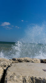 Sea waves splashing on rocks