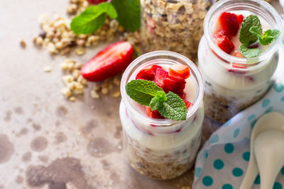 Homemade healthy breakfast with homemade baked granola, fresh strawberry and yogurt. 