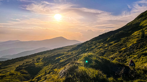 Scenic view of mountains against sky during sunset