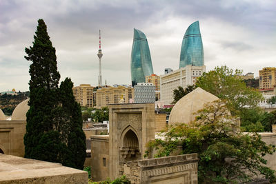 Buildings in city against sky