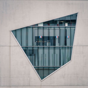 Building reflecting in water