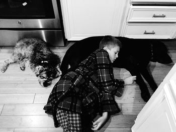 Rear view of people and girl on floor