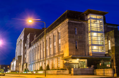 Low angle view of illuminated building at night