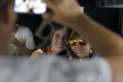 Close-up of man photographing friends