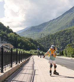 Rear view of man walking on mountain