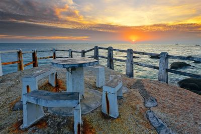 Scenic view of beach against sky during sunset