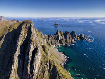 Panoramic view of rocks in sea against sky