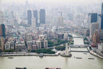 High angle view of river amidst buildings in city