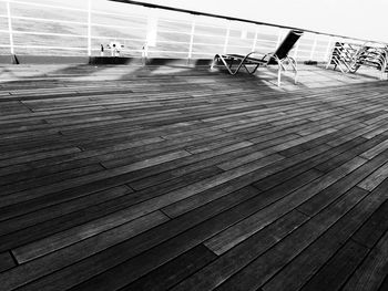 Surface level of boardwalk against sky