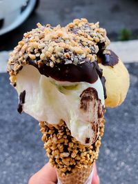 Close-up of hand holding ice cream