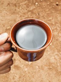 Close-up of woman holding coffee cup