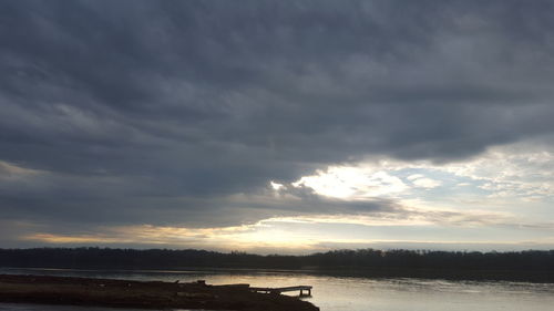 Scenic view of sea against cloudy sky