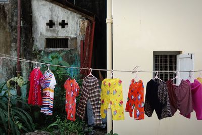 Clothes drying on clothesline outside building