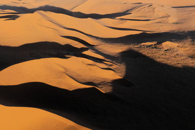 Shadow of person on sand