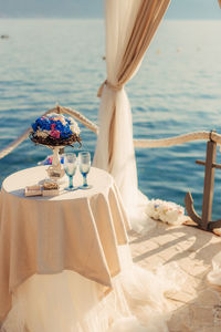 High angle view of people on table by sea