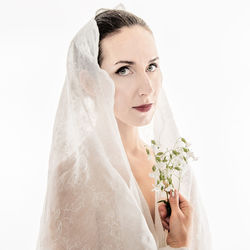 Portrait of woman against white background