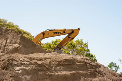 Low angle view of construction site against clear sky