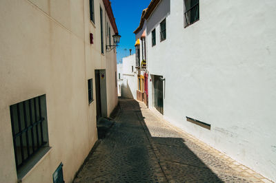 Narrow alley along buildings