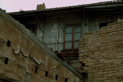 Low angle view of old building against sky