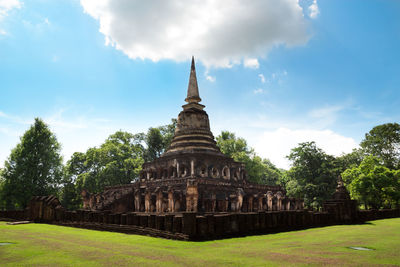 View of temple building against cloudy sky