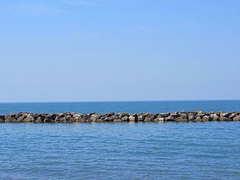 Scenic view of sea against clear blue sky