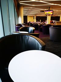 Empty chairs and table in restaurant