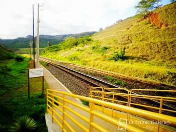 Scenic view of landscape against cloudy sky