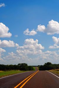 Empty road against sky