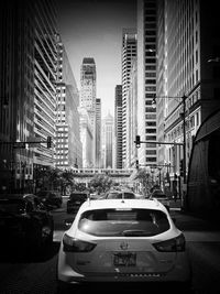 View of city street and buildings against sky