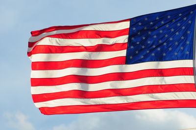 Low angle view of flag against sky