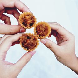 Close-up of cropped hand holding food