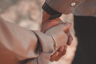 Close-up of man holding hands