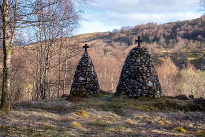 Panoramic view of old temple on field against sky