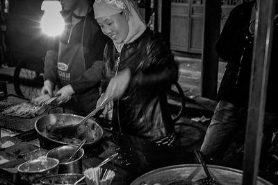 High angle view of people on barbecue grill