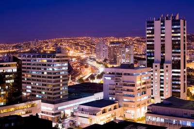 High angle view of illuminated cityscape at night