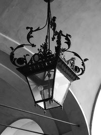 Low angle view of chandelier hanging on ceiling