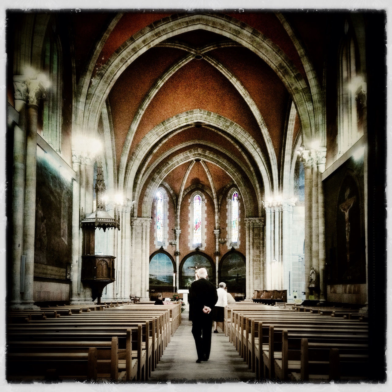 arch, indoors, rear view, lifestyles, full length, architecture, men, place of worship, person, leisure activity, built structure, religion, standing, spirituality, church, casual clothing, entrance, walking