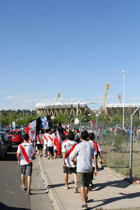 People on street against clear sky