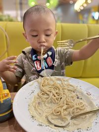 Close-up of boy eating food